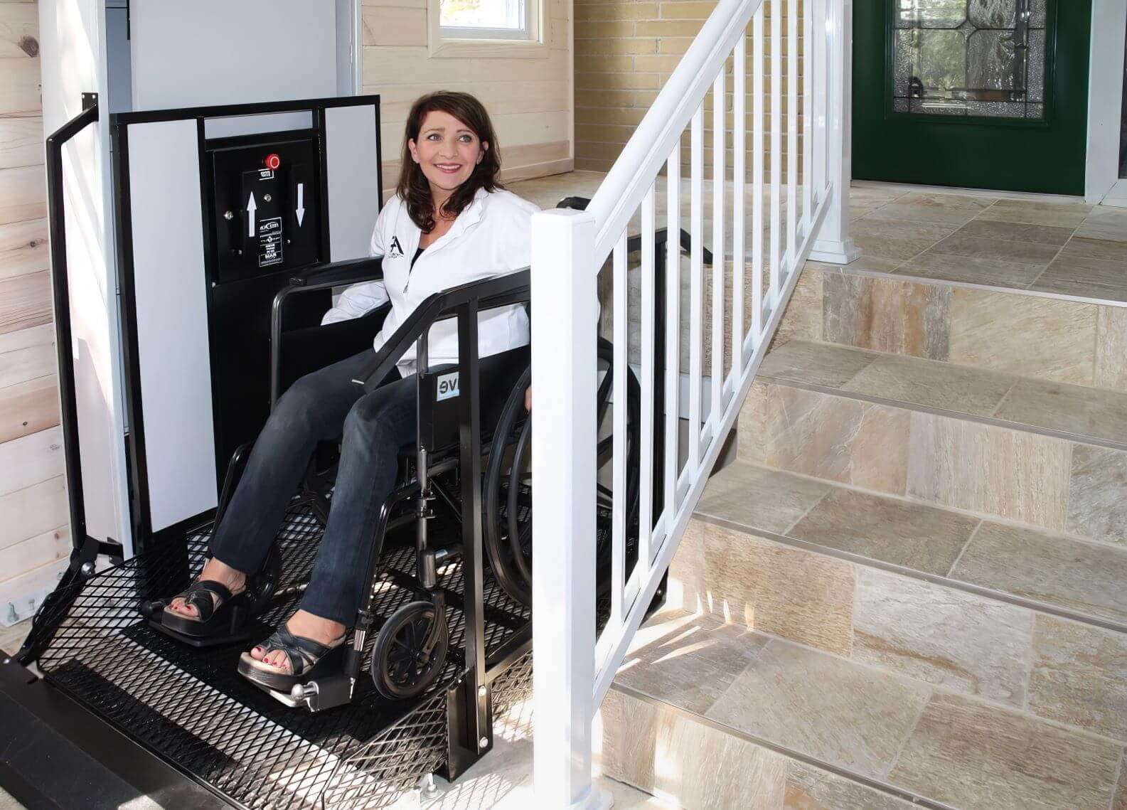   Woman in wheelchair on vertical wheelchair lift 